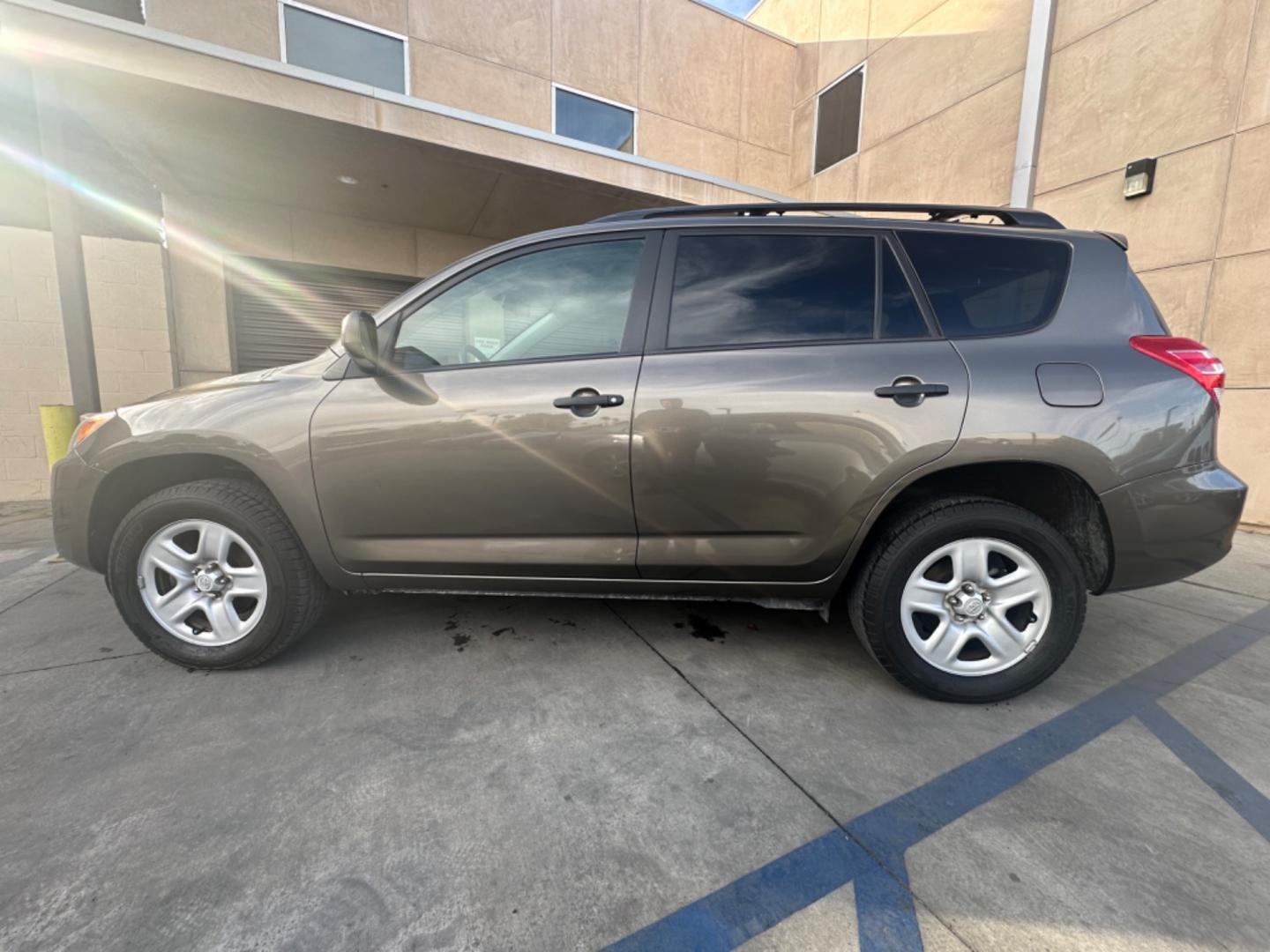 2012 Gray Toyota RAV4 Base I4 2WD with 3rd Row (2T3KF4DVXCW) with an 2.4L L4 DOHC 16V engine, 4-Speed Automatic transmission, located at 30 S. Berkeley Avenue, Pasadena, CA, 91107, (626) 248-7567, 34.145447, -118.109398 - Crown City Motors is a used “Buy Here Pay Here” car dealer in Pasadena CA. “Buy Here Pay Here” financing, means that when you purchase your vehicle from our dealership, that you make the payments to the dealership as well. We do not need the banks approval to get you approved for a used auto - Photo#2